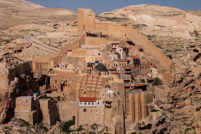 Judean Desert Jeep Adventure from Jerusalem - Seeing Mar Saba Monastery from a cliffside perch