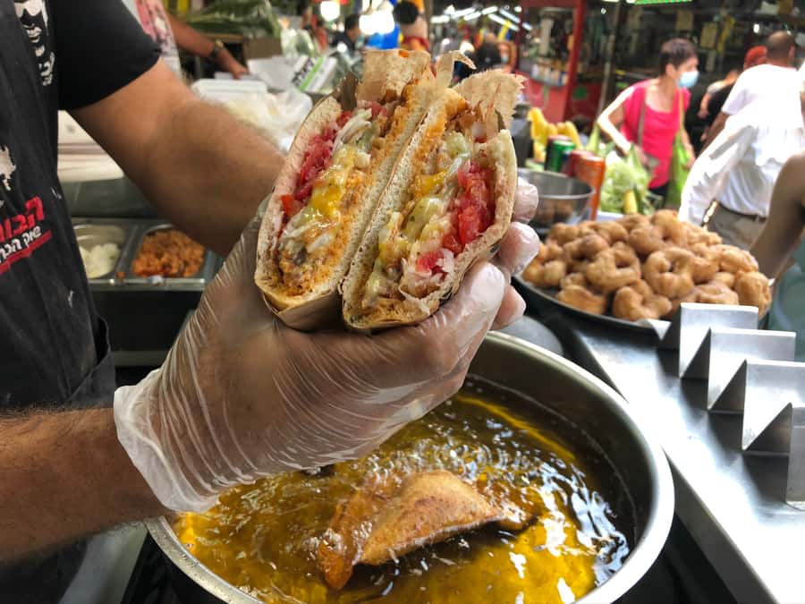 Tel Aviv: 2-Hour Carmel Market Tour in English with Lunch - The opening walk through stalls, spices, and side lanes