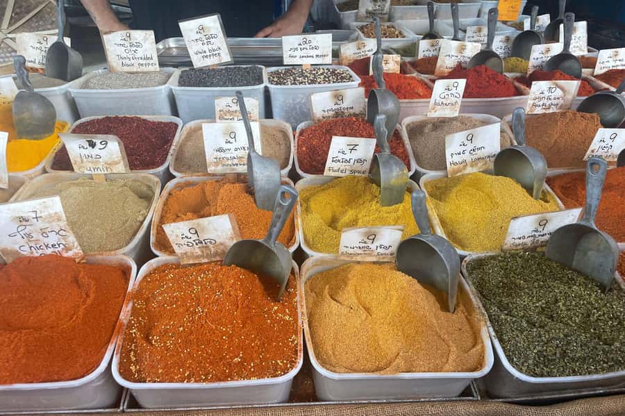 Tel Aviv: Carmel Market & Neighborhood Guided Walking Tour - Spices, produce, bakeries, and the working shuk